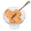 Photo: Biscuits in a glass bowl on a white background Biscuits in a glass bowl on a white background