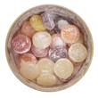 Photo: Mixed fruit candies in tin jar. Isolated on white Mixed fruit candies in tin jar. Isolated on white