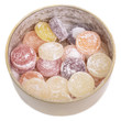 Photo: Mixed fruit candies in tin jar. Isolated on white Mixed fruit candies in tin jar. Isolated on white
