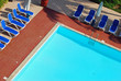 Sun Loungers by a Swimming Pool