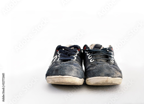 Photo: Blue sneakers isolated on white Blue sneakers isolated on white