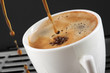 coffee expresso being poured into a mug
