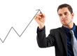Businessman drawing a growing business graph isolated on white
