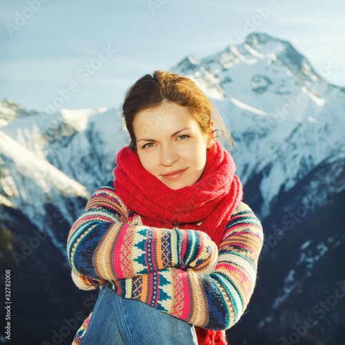 Photo: Attractive girl with mountains in background Attractive girl with mountains in background