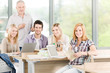 Group of high-school students with mature professor Group of high-school students with mature professor