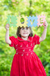 Happy little girl holdind-up words love