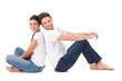 Cheerful couple smiling happily on floor