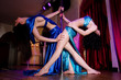 Two strippers posing on stage at the pole Two strippers posing on stage at the pole