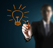 Photo: hands,drawing light bulb hands,drawing light bulb