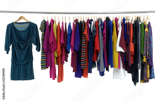 Photo: Row of clothing on hanger in a row Row of clothing on hanger in a row