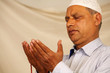 hands with muslim prayer beads