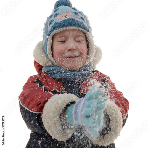 Photo: The boy claps his hands and fly snowflakes The boy claps his hands and fly snowflakes