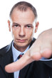 young business man in a suit pointing with his finger