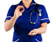 nurse holding pill