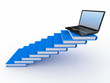 Staircase from books and laptop on the top