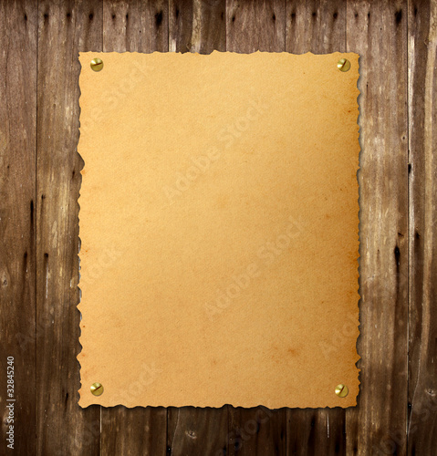 Photo: Old vintage poster on wood. Old vintage poster on wood.
