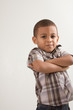 Photo: Young little boy in checkered shirt and jeans Young little boy in checkered shirt and jeans