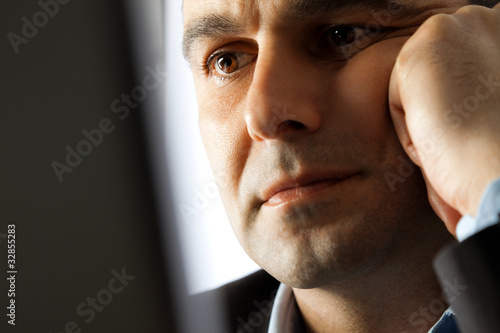 Photo: serious man thinking serious man thinking