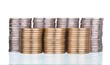 Silver and gold coins stacks on white
