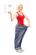 Weight loss female holding a weight scale