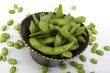 Edamame soy beans in a brown ceramic dish