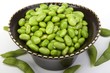 Edamame soy beans in a brown ceramic dish