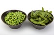 Edamame soy beans in a brown ceramic dish