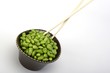 Edamame soy beans in a brown ceramic dish