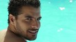 young man sitting in swimming pool