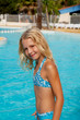 girl in bikini by swim pool