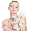 Girl with fresh skin and flowers