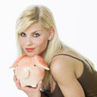 Photo: woman's portrait with a piggy bank woman's portrait with a piggy bank