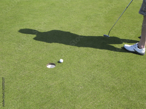 Photo: Golfball near hole Golfball near hole