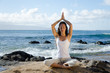 Woman Meditating at the Beach