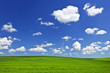 Photo: Green rolling hills under blue sky Green rolling hills under blue sky