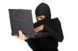 Photo: criminal woman in balaclava with the laptop criminal woman in balaclava with the laptop