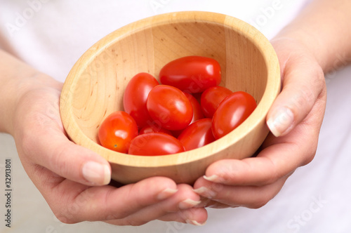 Photo: cherry tomatoe betwen the hands cherry tomatoe betwen the hands