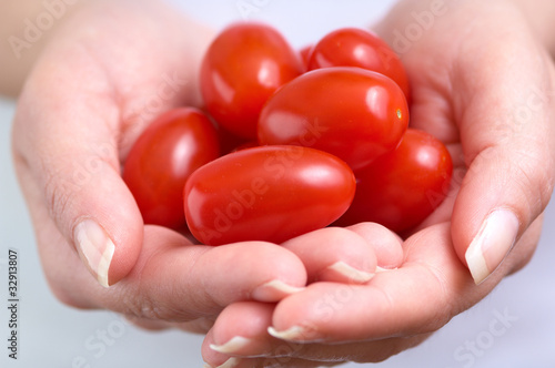 Photo: cherry tomatoe betwen the hands cherry tomatoe betwen the hands