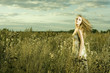 Portrait of beautiful girl in field