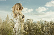 Portrait of beautiful girl in field