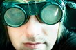 Young survivor of the apocalypse in goggles with light