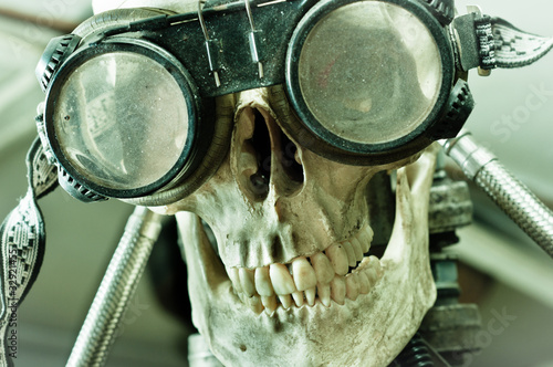 Photo: Human skull with insane look and goggles (robot) Human skull with insane look and goggles (robot)