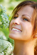 Happy young woman and wild flowers.