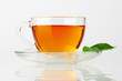 Photo: Cup with tea and green leaf Cup with tea and green leaf