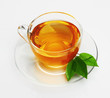 Photo: Cup with tea and green leaf Cup with tea and green leaf