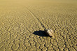 "Sailing stones" that leave linear "racetrack" imprints