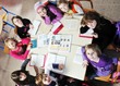 happy kids with teacher in school classroom happy kids with teacher in school classroom