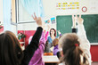 happy kids with teacher in school classroom happy kids with teacher in school classroom