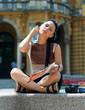 woman tourist cooling herself