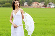 Beautiful bride posing outdoors.